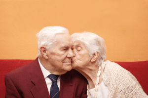 Senior couple kiss