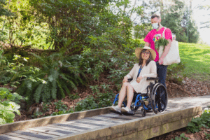 Nurse Next Door Caregiver and client in wheelchair